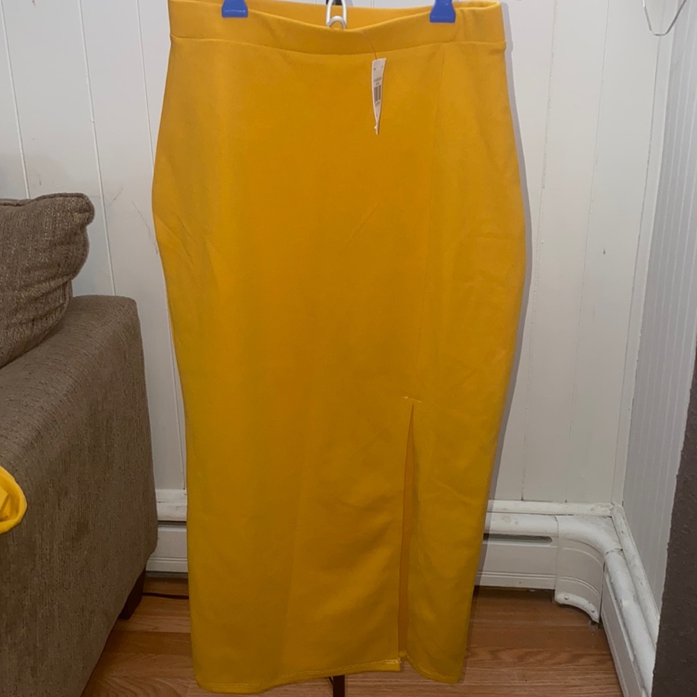 Small two piece skirt and top. Mustard color brand new with tags.